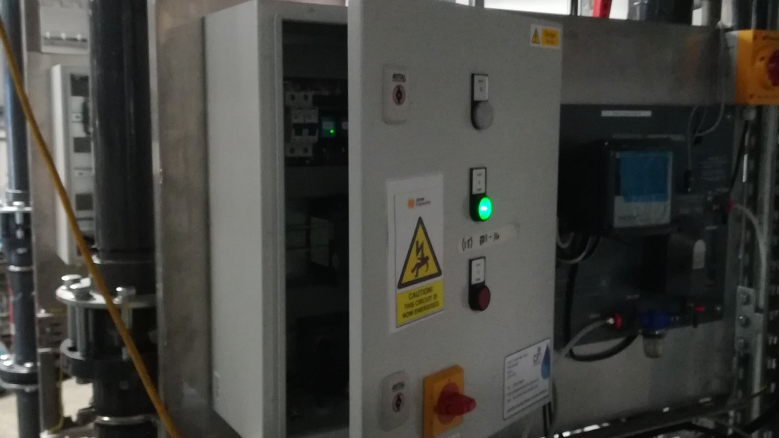 Plantroom BMS control panel installed among pipework